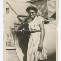 Palm Solistine Briscoe standing at the bottom of emergency chute at original Garnet High School 