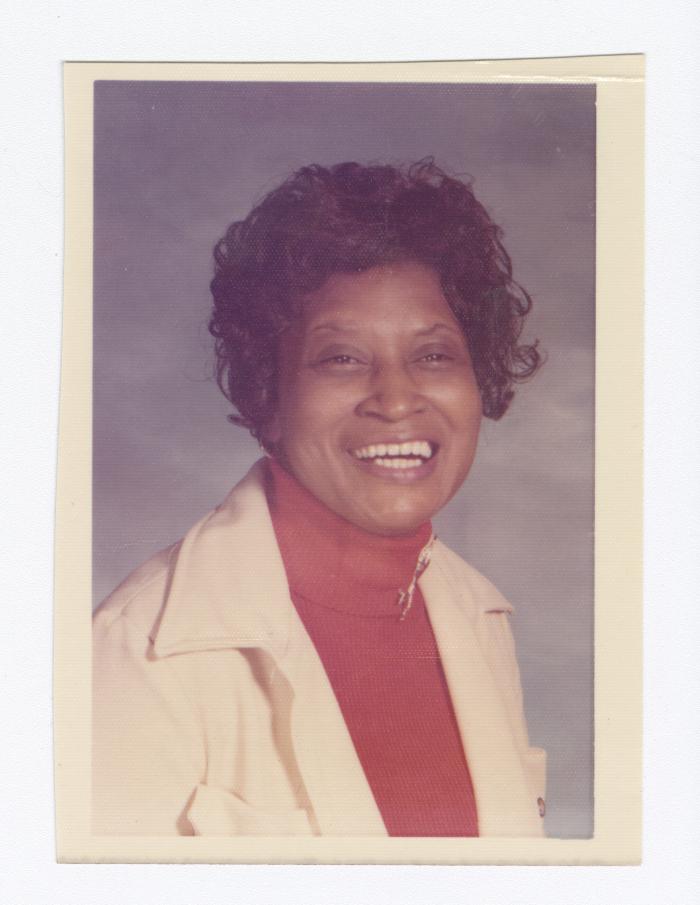 Portrait of Palm Solistine Briscoe smiling widely
