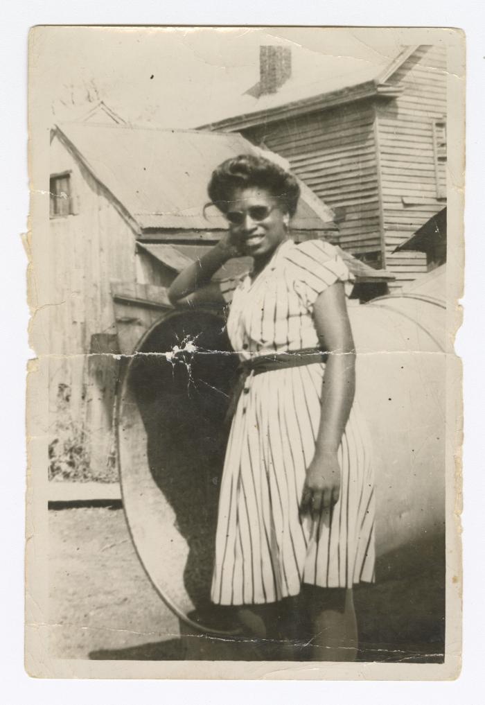 Palm Solistine Briscoe standing at the bottom of emergency chute at original Garnet High School 