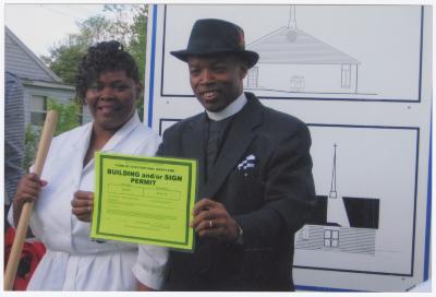 Ronald T. Fisher with building permit