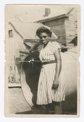 Palm Solistine Briscoe standing at the bottom of emergency chute at original Garnet High School 