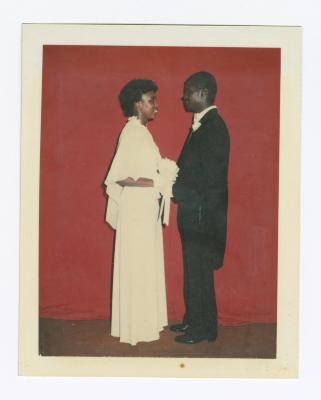 Debutante Kim Briscoe Moody looking into the eyes of her escort
