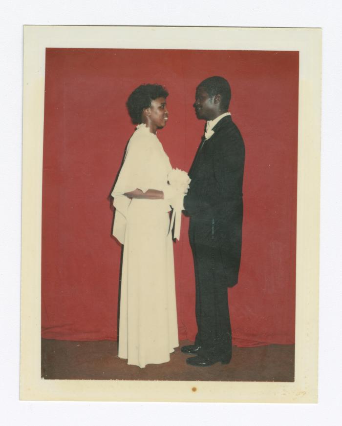 Debutante Kim Briscoe Moody looking into the eyes of her escort