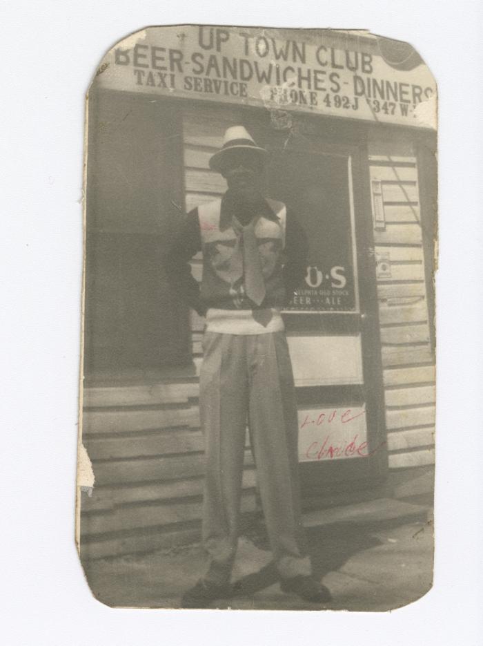 Claude Gilbert standing in front of the original Uptown Club