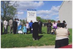 Group gathered outside the Gospel Church of God