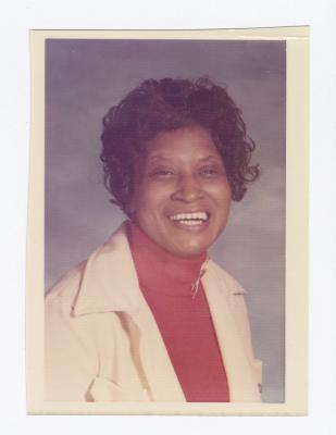 Portrait of Palm Solistine Briscoe smiling widely
