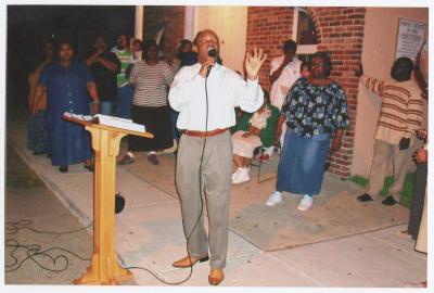Street service outside Gospel Church of God
