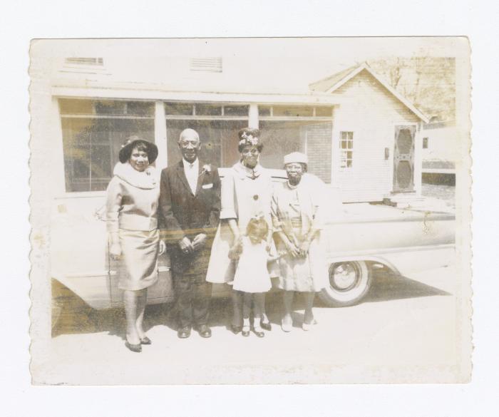 Solistine Briscoe and daughter Kim standing with family