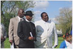 Three men outside