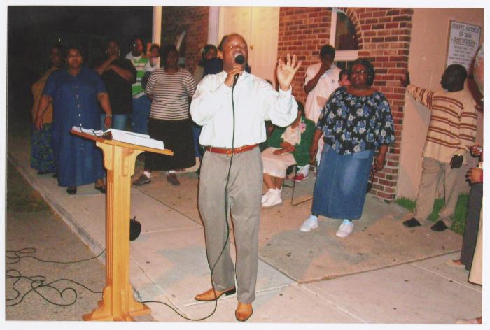 Street service outside Gospel Church of God