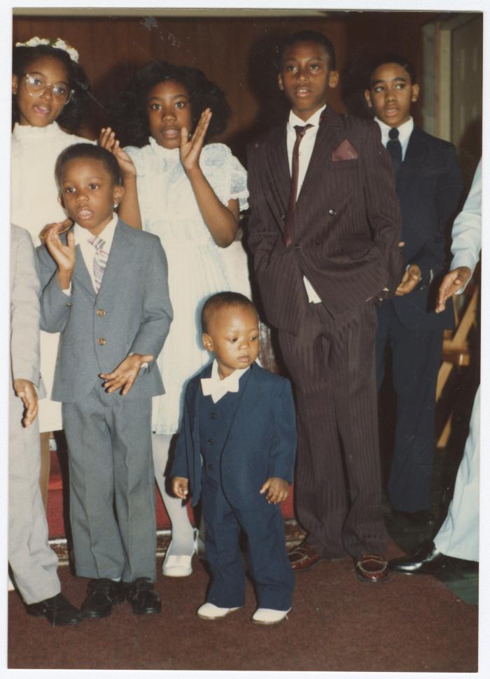 Children dressed formally at the Gospel Church of God