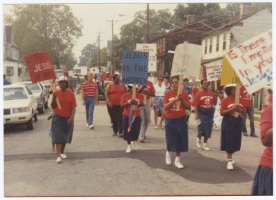 Group marching down Calvert Street