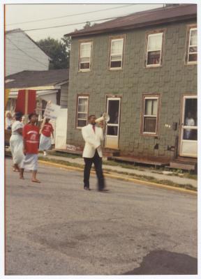 Bishop Ronald T. Fisher leading march with a megaphone