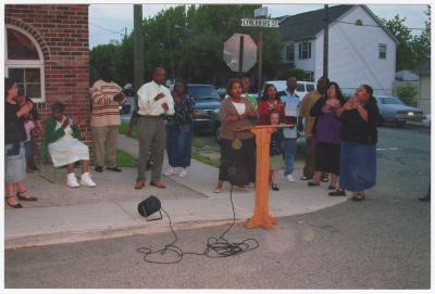 Street service outside the Gospel Church of God