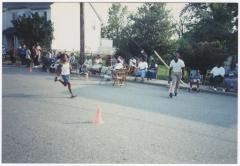 Young boy running on Calvert Street