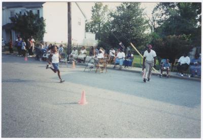 Young boy running on Calvert Street