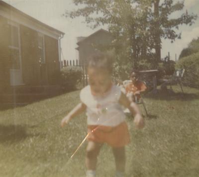 Little girl and boy in the Lively's backyard