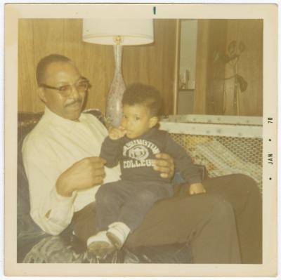 Calvin Hamilton sitting with Jay Anderson on his lap