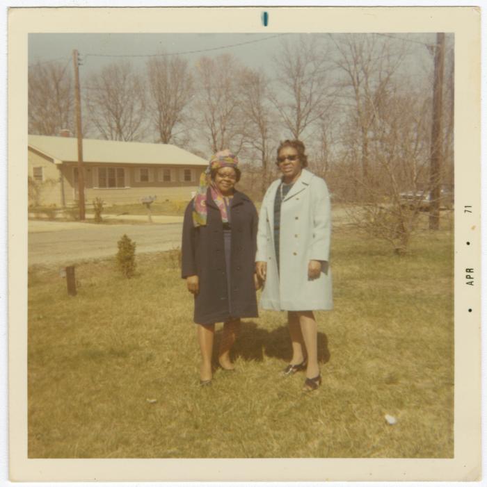 Helen Hamilton and sister Lauretta H. Dotson standing in front of Helen's house