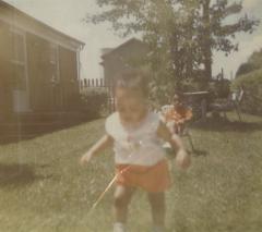 Little girl and boy in the Lively's backyard