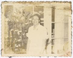 A woman in front of a Christmas tree