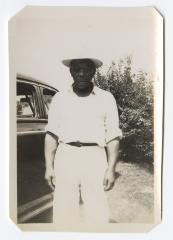 Man standing next to vehicle