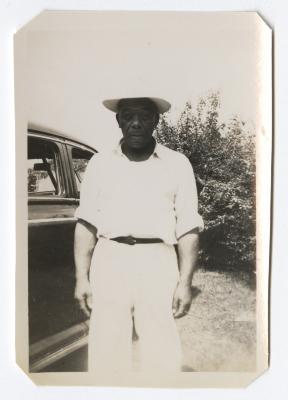 Man standing next to vehicle