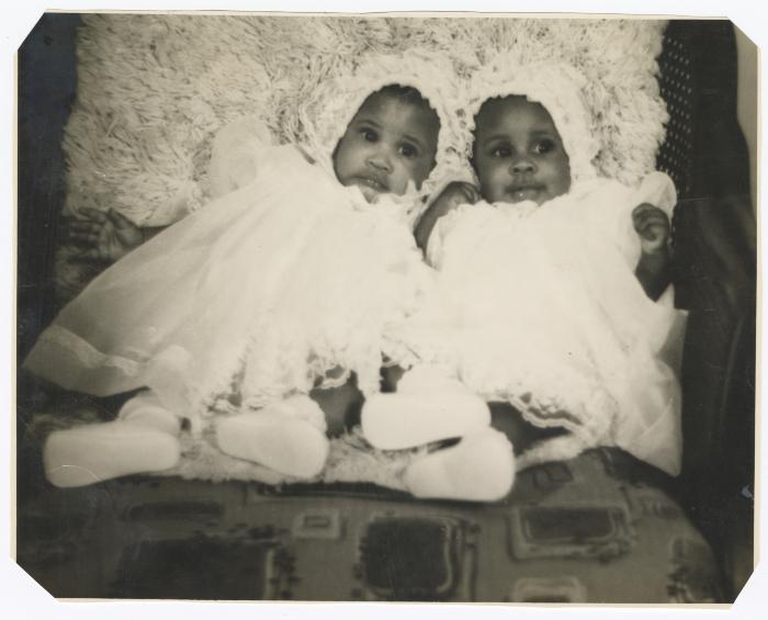 Twins Tara and Tina Sparks in their christening outfits 