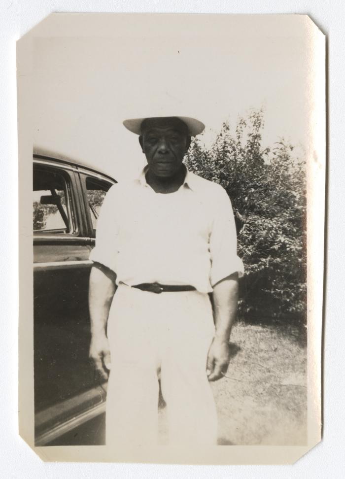 Man standing next to vehicle