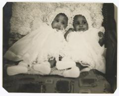 Twins Tara and Tina Sparks in their christening outfits 