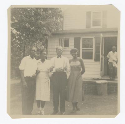 Group of four posing outside