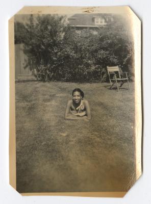 Young woman lying in the grass