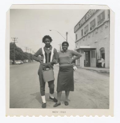 Sylvia Sparks and a friend posing while on a bus trip