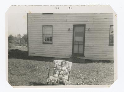 Kenneth Sparks Jr. in a lawn chair in front of family home