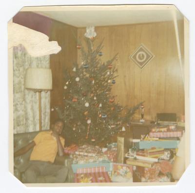 Marlon Cornell Sparks posing by a Christmas tree