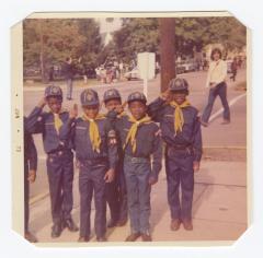 Cubs Scouts saluting during a parade