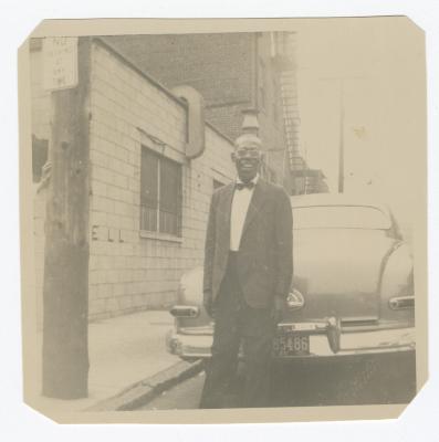 Man standing behind a car