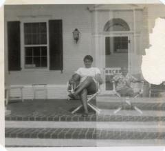 Woman and young boy sitting on a porch