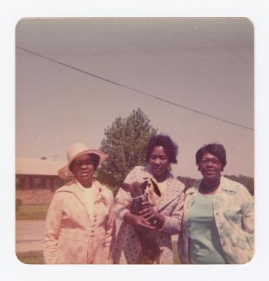 Helen Walley, Sylvia Walley, and Pearl Hackett with a dog