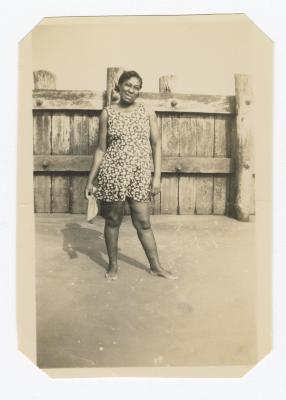Woman in a floral dress at the beach