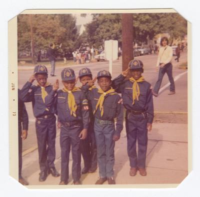 Cubs Scouts saluting during a parade