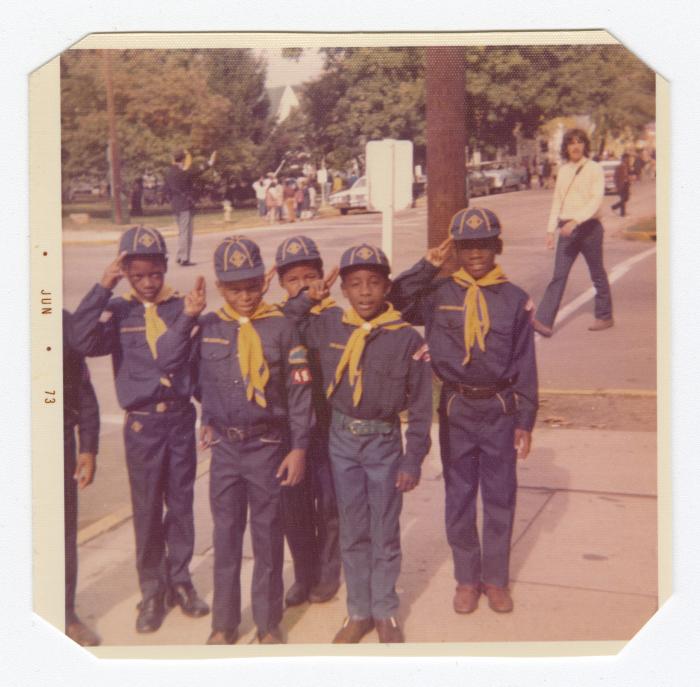 Cubs Scouts saluting during a parade