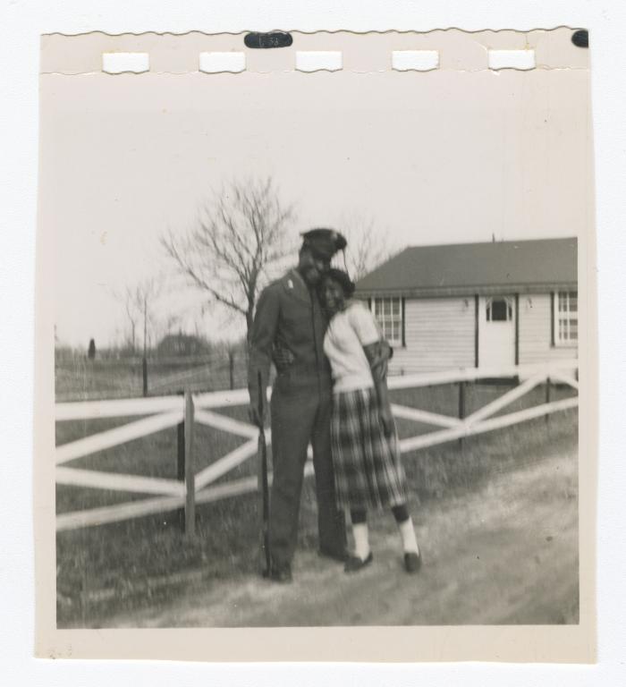 Soldier hugging a woman