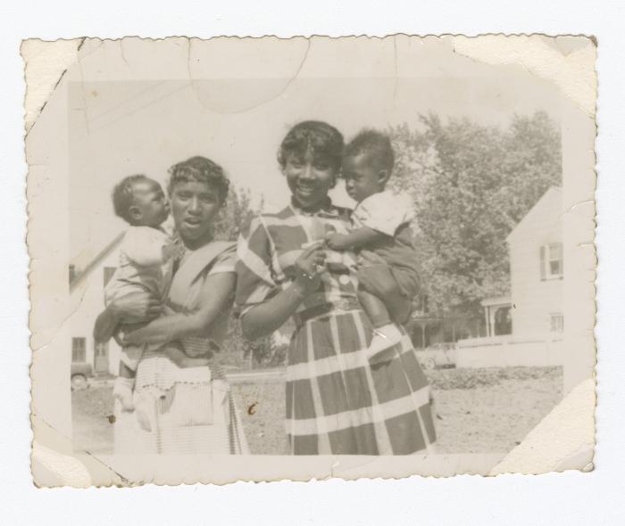 Two young girls with babies