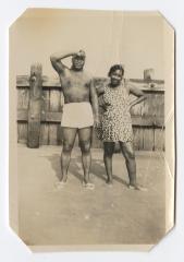 Man and woman standing on the beach