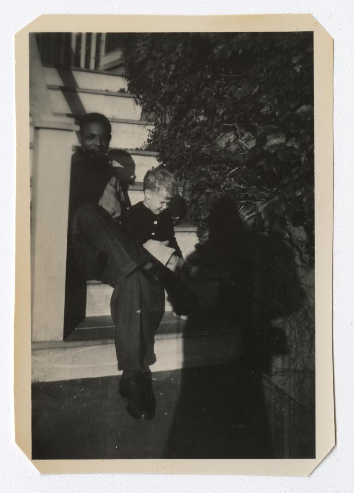 Man and young boy sitting on a staircase