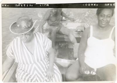 Two women and a man in a boat
