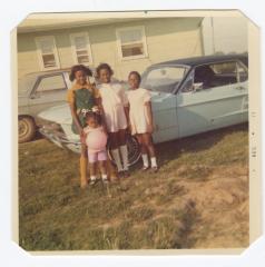 Four young girls and a classic car