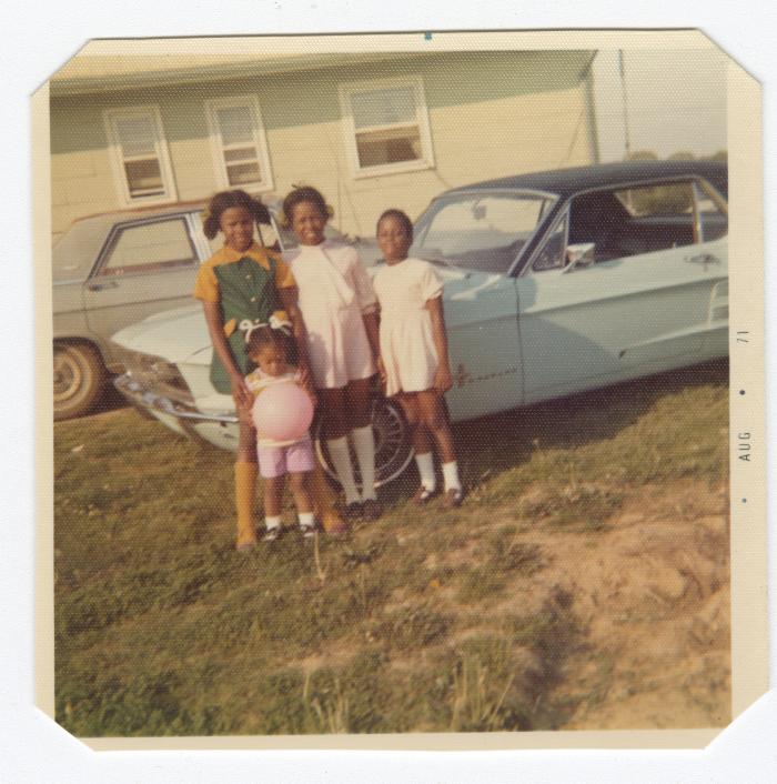 Four young girls and a classic car