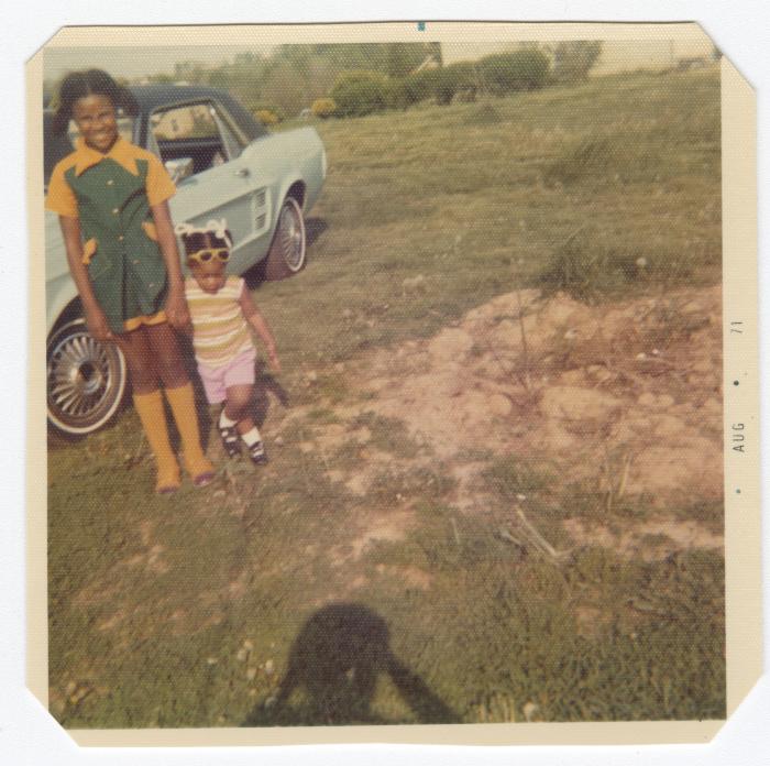 Two young girls holding hands